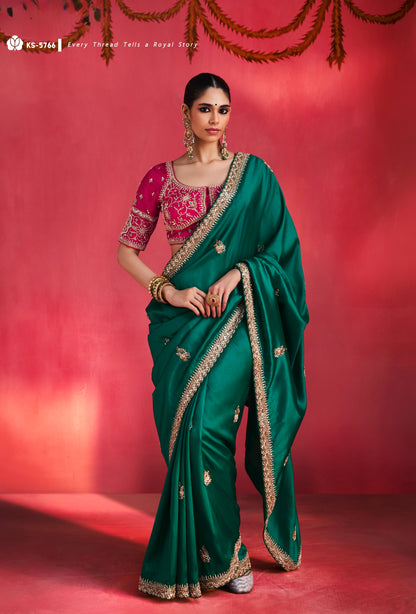 Emerald green silk saree with gold border and maroon blouse, full-body