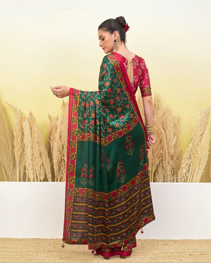 Green printed saree with maroon and gold border, draped with pleated pallu