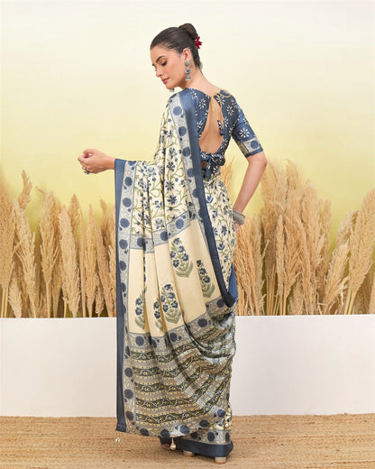 Ivory and blue crepe silk easy saree with floral motifs, draped with border