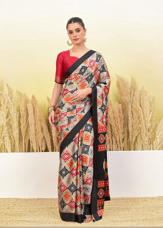 Ivory and black crepe silk saree with red geometric border, pleated drape and pallu