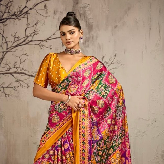 Close view of a yellow saree with a multicolor floral drape and matching dotted blouse