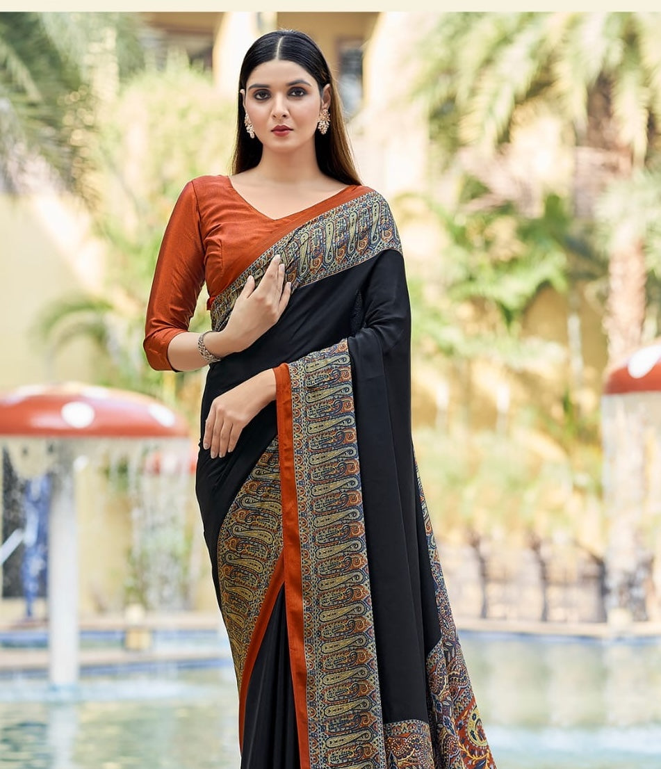 Black crepe silk saree with ornate patterned border and rust blouse, ready-to-wear fit