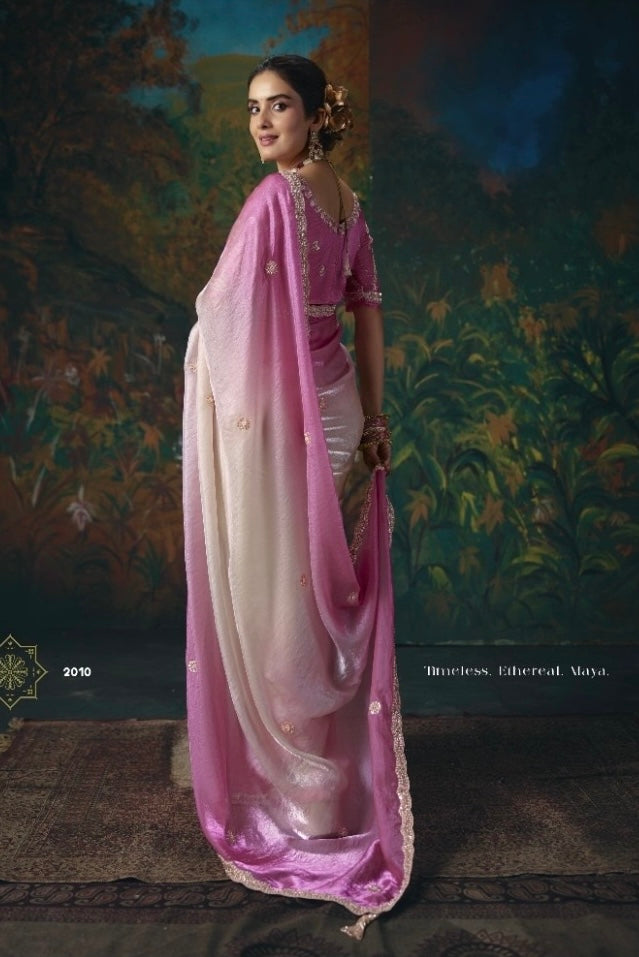 Ready-to-wear tissue silk saree in pink and cream, shown from the back with embellished border.