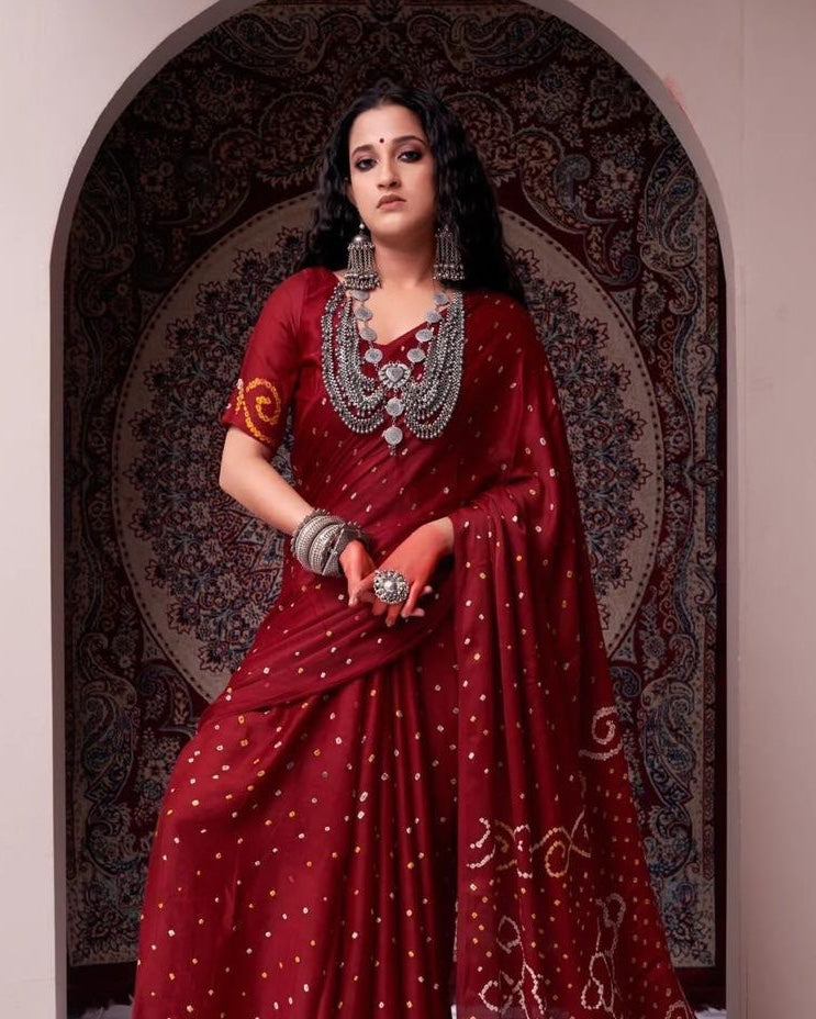 Dark red silk ready-to-wear saree with gold accents and embellished blouse, front view