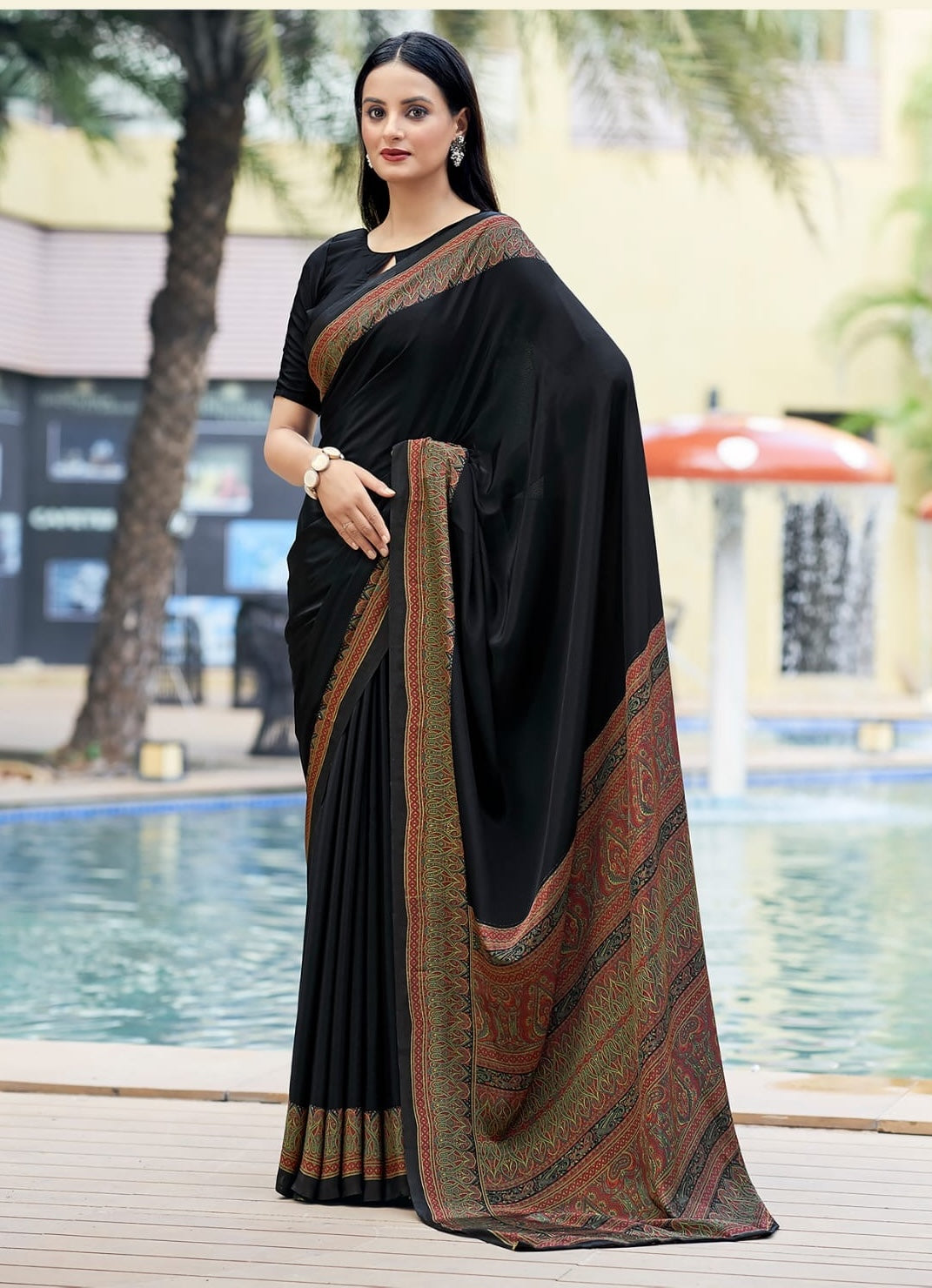 Ready-to-wear black crepe silk saree with rust-and-gold border and patterned pallu