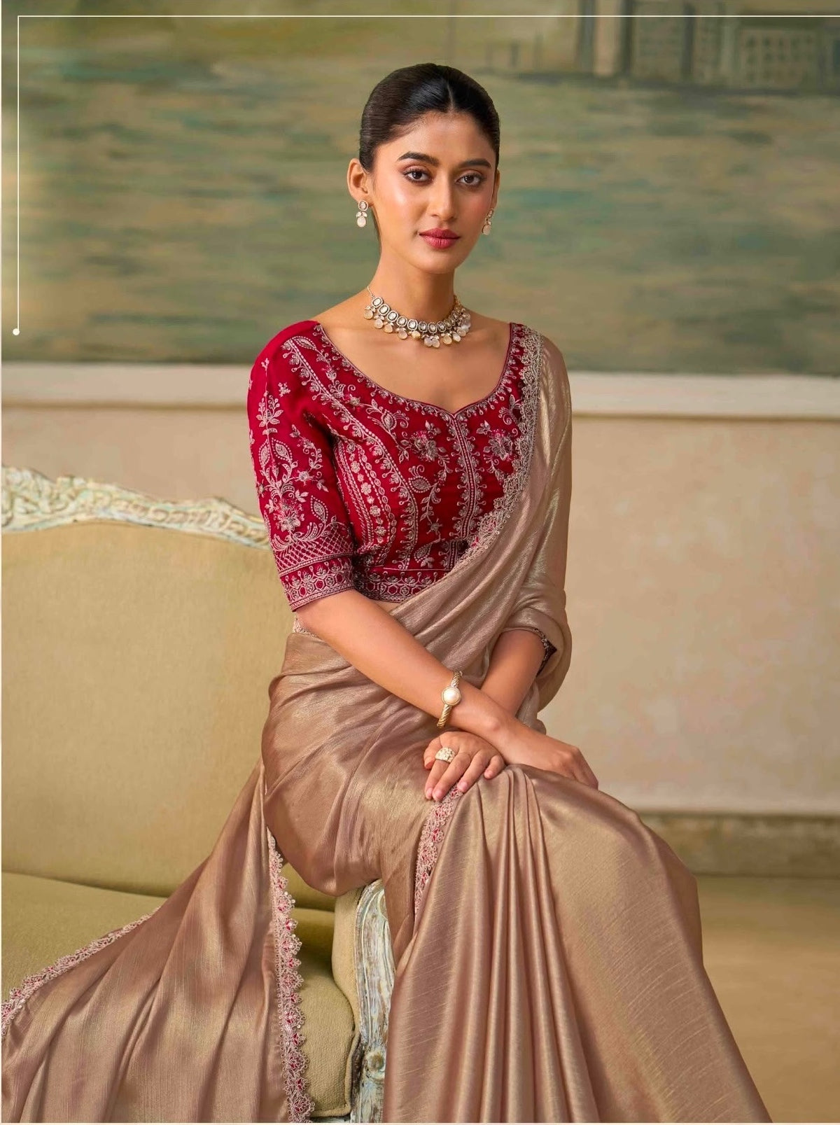 Bronze ready-to-wear saree with red patterned blouse, embellished neckline and lace border