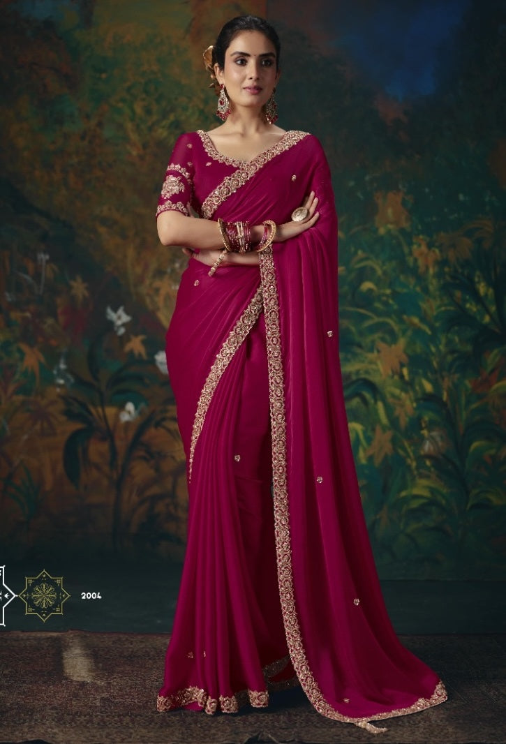 Magenta tissue silk ready-to-wear saree with ornate gold trim and matching short-sleeve blouse