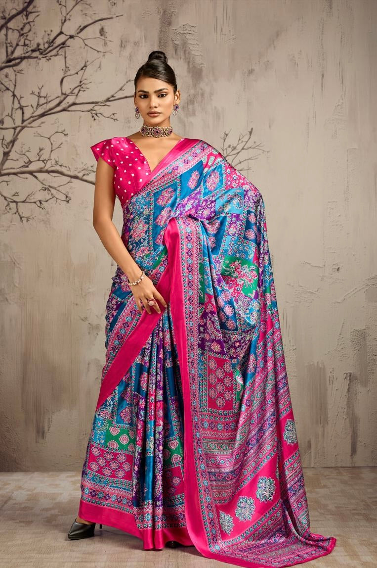 Model wearing a pink and blue patterned ready-to-wear saree with a magenta dotted blouse