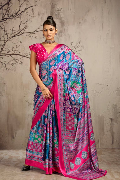 Model wearing a pink and blue patterned ready-to-wear saree with a magenta dotted blouse