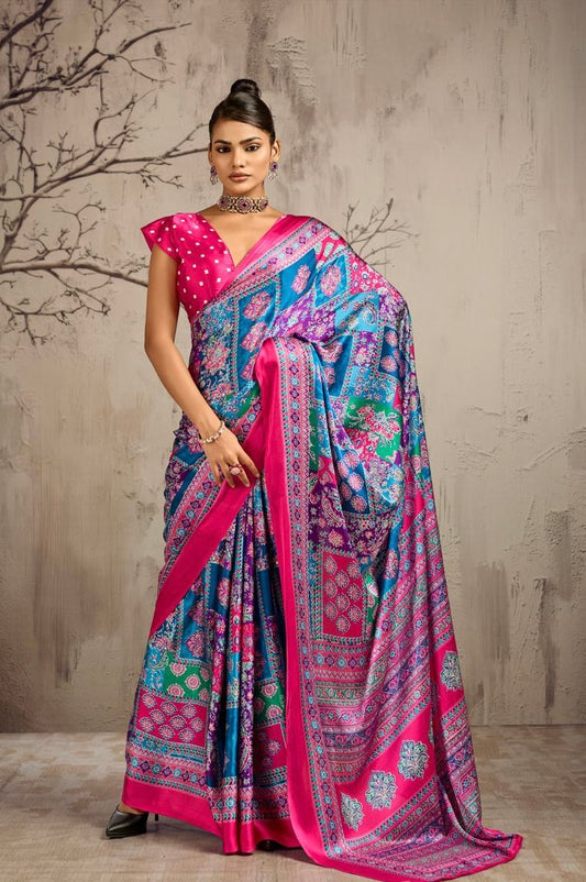 Model wearing a pink and blue patterned ready-to-wear saree with a magenta dotted blouse