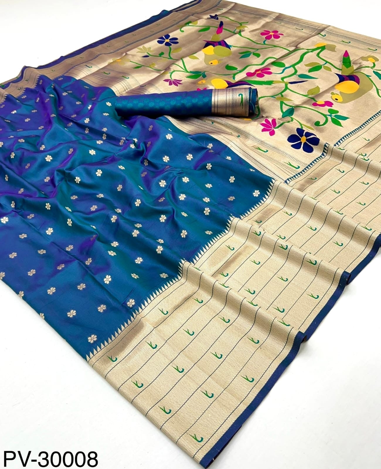 Blue and beige saree with floral pallu and small gold dot motifs, flat lay