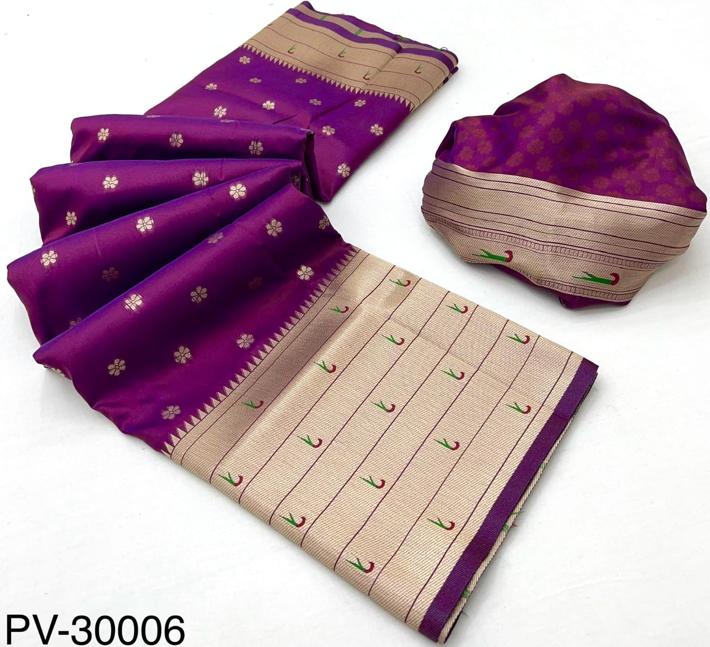 Folded magenta and beige silk saree set with patterned pallu and matching roll