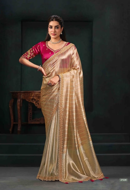 Beige saree with gold border and magenta pre-stitched blouse, shown full length