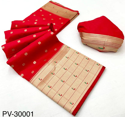 Cherry red saree with beige border and matching folded fabric piece, flat lay