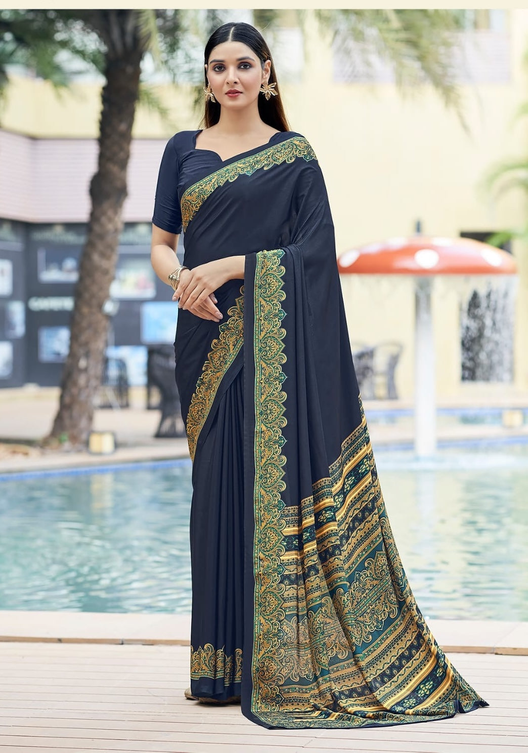 Charcoal crepe silk easy saree with gold-and-green border, draped with short sleeve