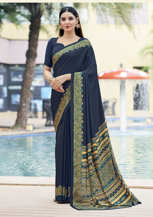 Charcoal crepe silk easy saree with gold-and-green border, draped with short sleeve