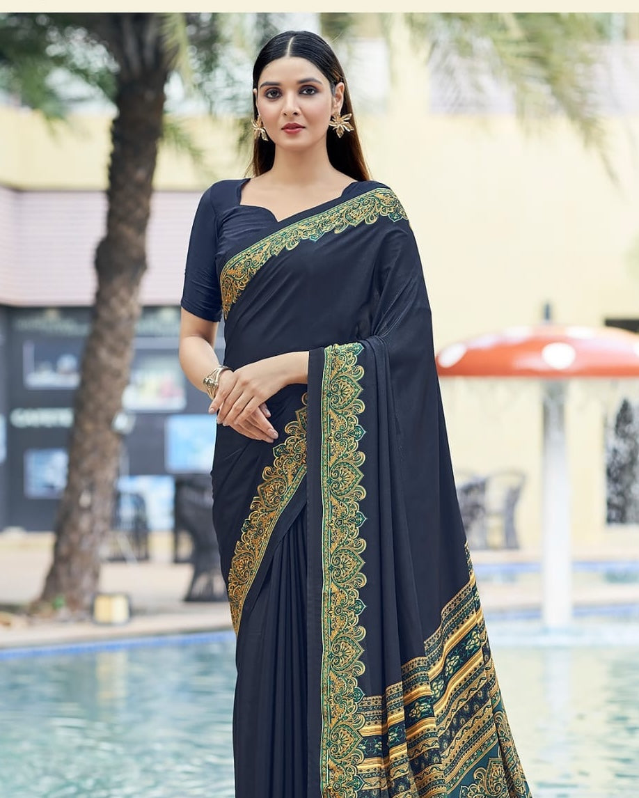 Charcoal crepe silk easy saree with ornate gold-and-green panel at shoulder and border