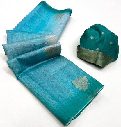 Turquoise blue printed linen saree with light gold motifs and green border, folded