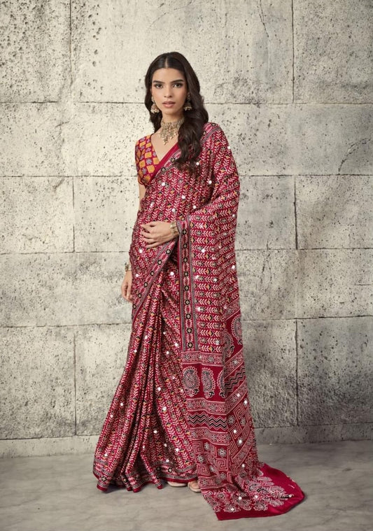 Red patterned easy saree dress with long sleeves, V-neck, and ornate border