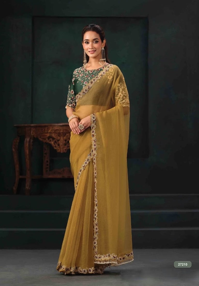 Mustard gold pre-stitched saree with green floral blouse and embroidered border