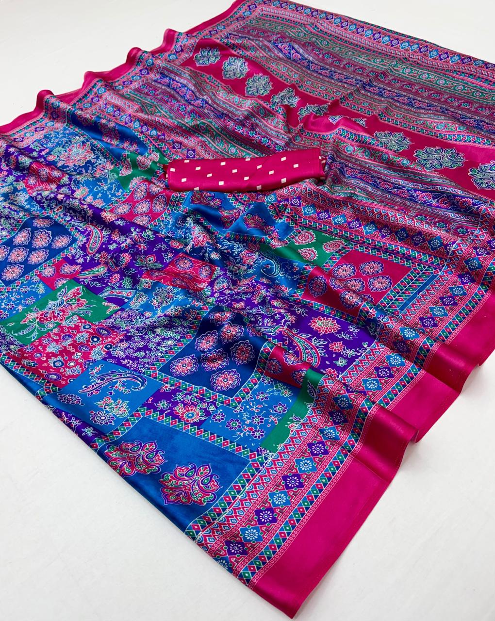 Pink modal silk ready-to-wear saree with blue, green and magenta floral patterns and a matching blouse piece