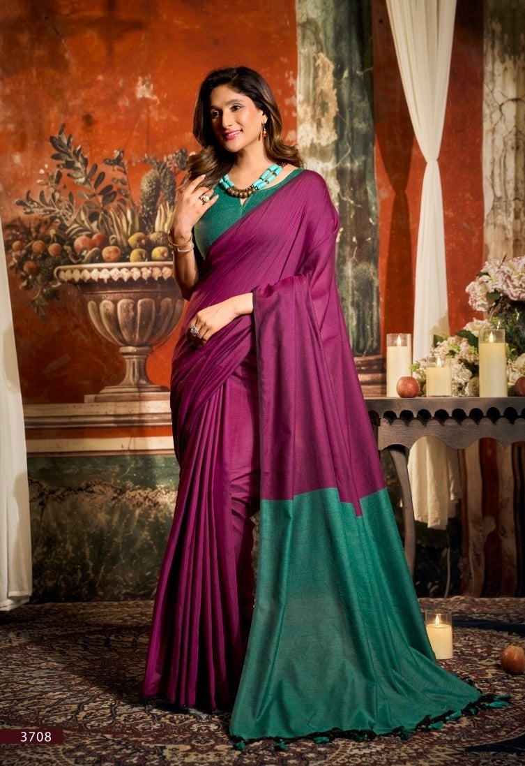 Magenta cotton easy saree with teal green border draped over one shoulder