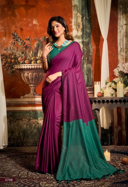 Magenta cotton easy saree with teal green border draped over one shoulder